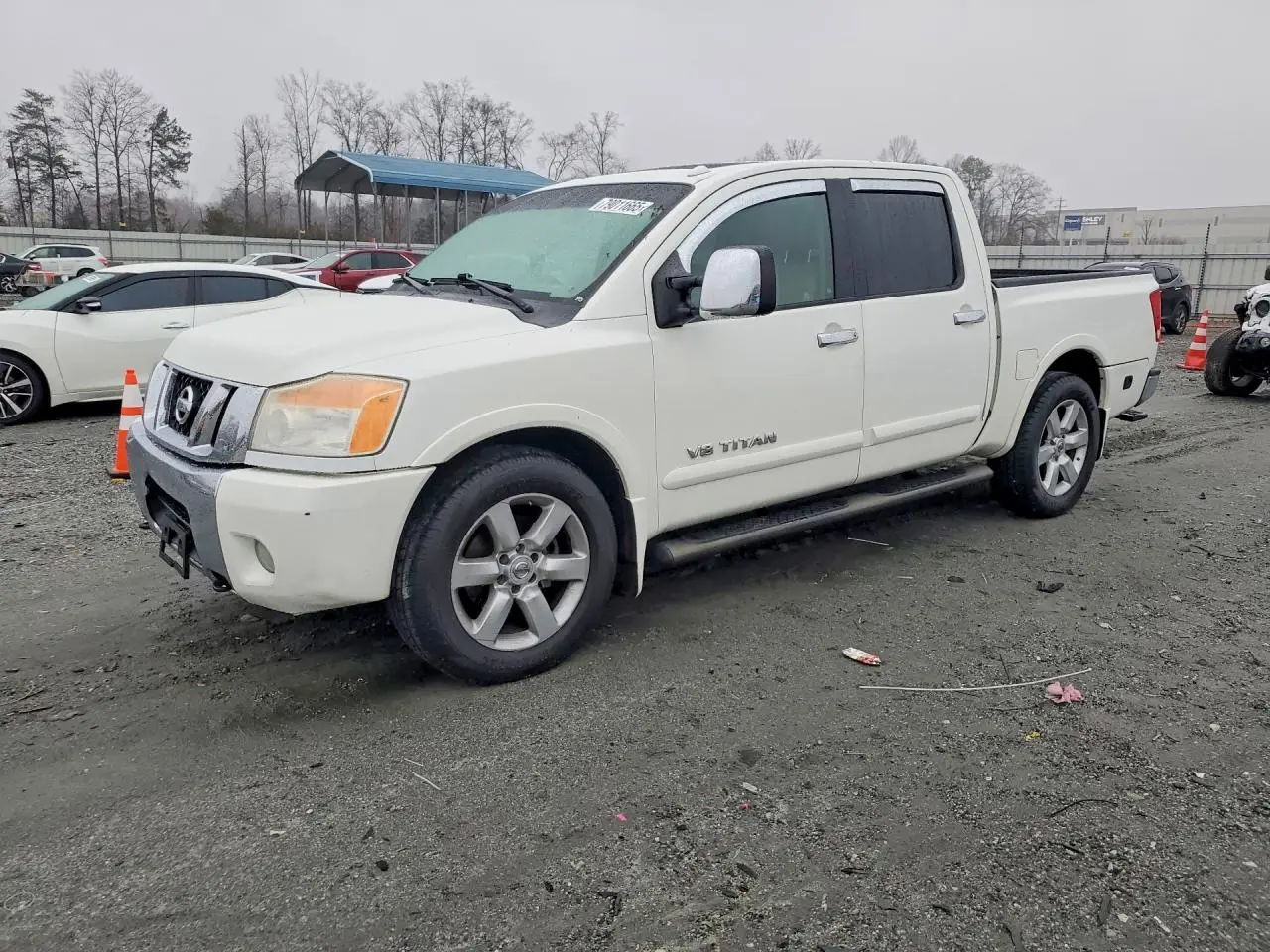 NISSAN TITAN 2010. Lot# 79011665. VIN 1N6BA0ED4AN323907. Photo 1